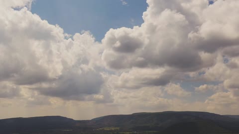 Open mountains and white clouds in the wild