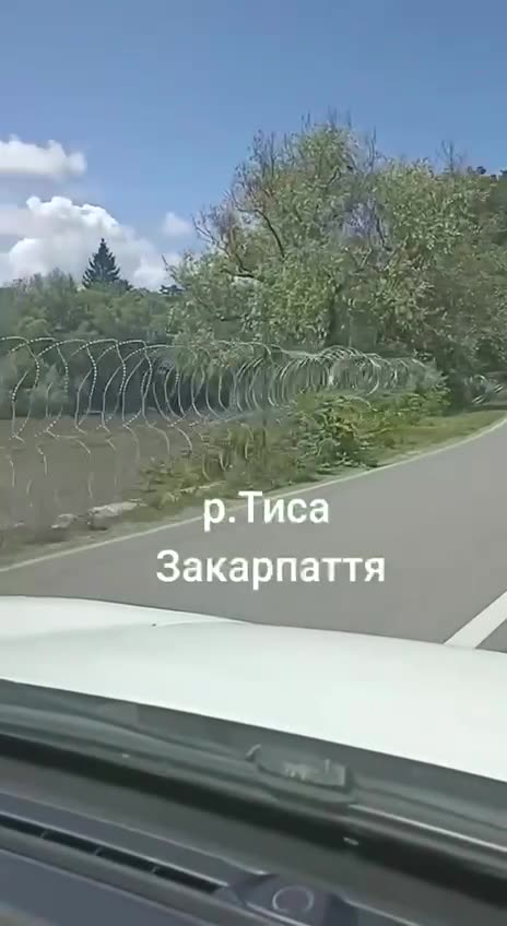 Barbed wire along the Ukrainian bank of the Tissa River