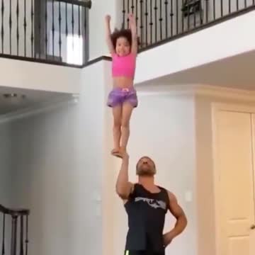 Girl and father acrobatic