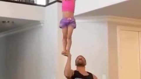 Girl and father acrobatic