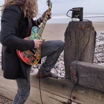 Playing Guitar at the Beach