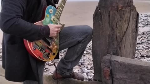 Playing Guitar at the Beach