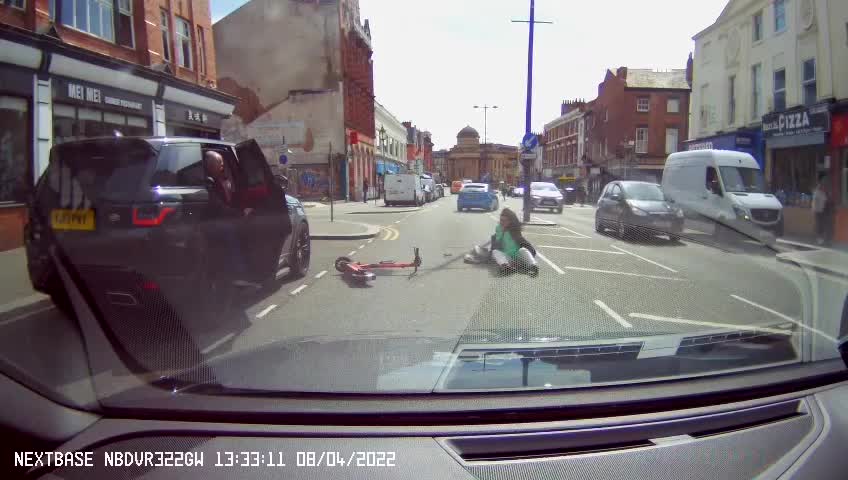 Woman Riding Scooter Gets Doored by Guy in Parked Car