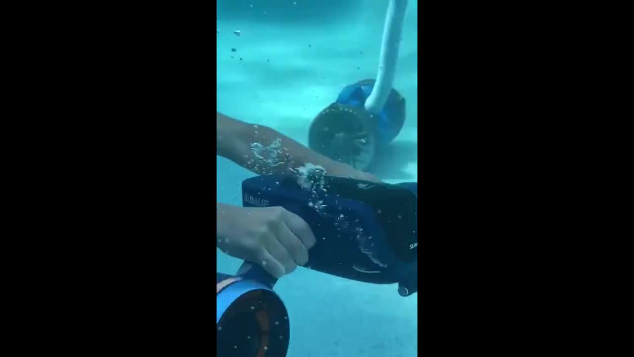 Kid has a blast playing with cool underwater scooter