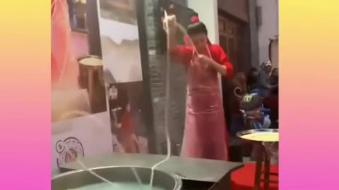 Skillful Chinese Women making Noodles