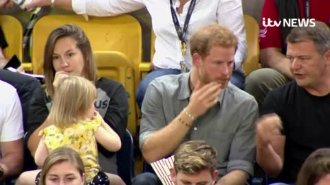 Prince Harry and baby in match