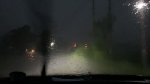 Lightning Strikes Near Moving Car