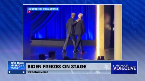 BIDEN FREEZES ON STAGE