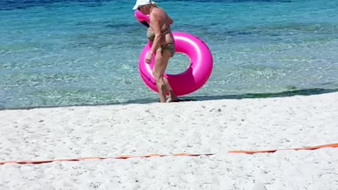 Woman Gets Stuck Inside Inflatable Pink Flamingo Float