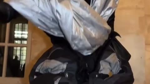 Person Wears Fashionable, Enormous "Necklace" and Stylish, "Special Suit"