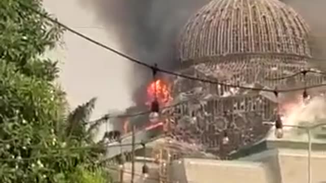 The dome of the Grand Mosque of the Islamic Center collapses