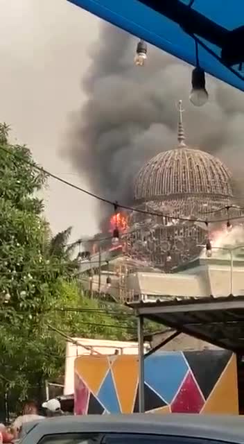 The dome of the Grand Mosque of the Islamic Center collapses