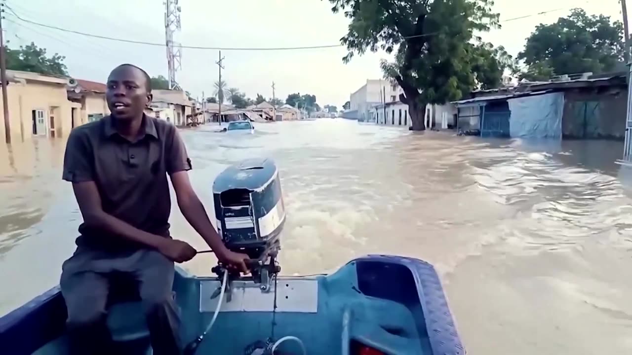 Rescuers help people off rooftop as floods hit Nigeria