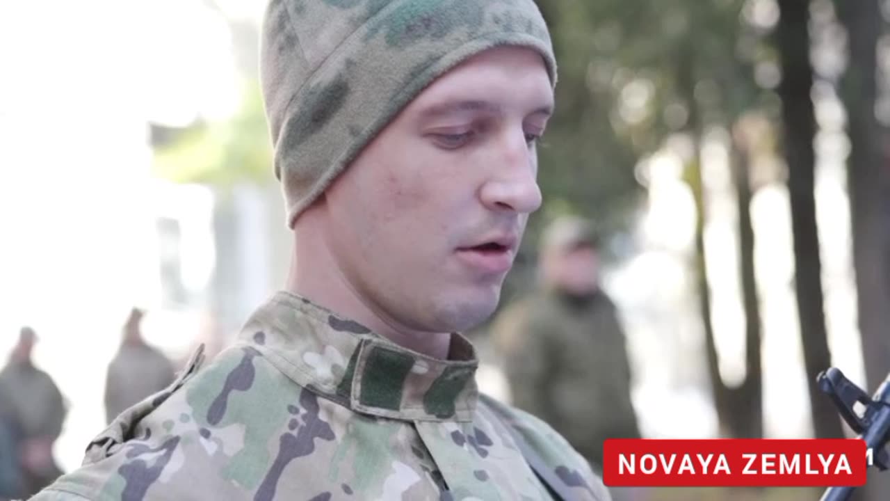A group of Ukrainian POWs take oath to serve in the Russian Army