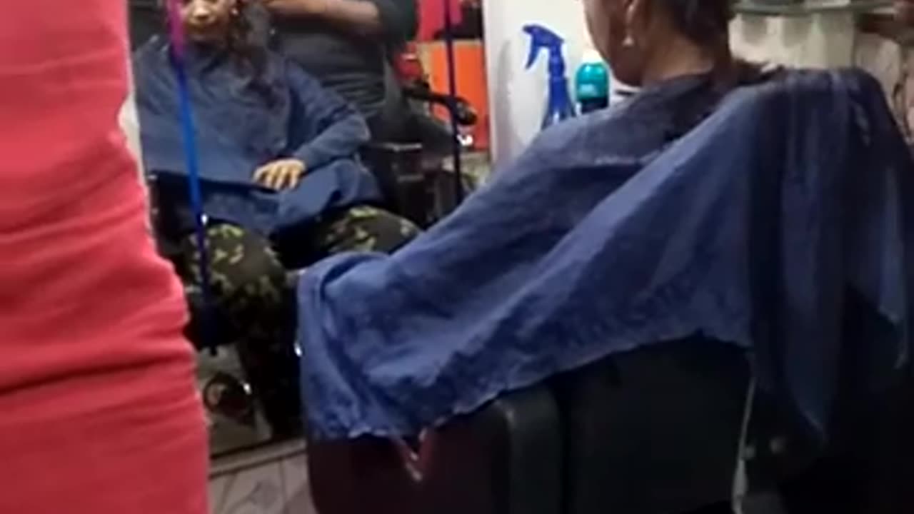 Young Indian girl headshave at barbershop 2024