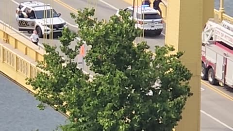 Man on top of Bridge in Pittsburgh