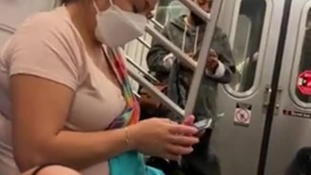 NYC subway passenger goes on racist tirade, accosts Asian family.