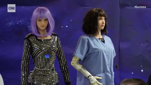 A GROUP OF 9 HUMANOID ROBOTS ANSWERED QUESTIONS FROM REPORTERS AT A PRO -AI UN SUMMIT IN GENEVA