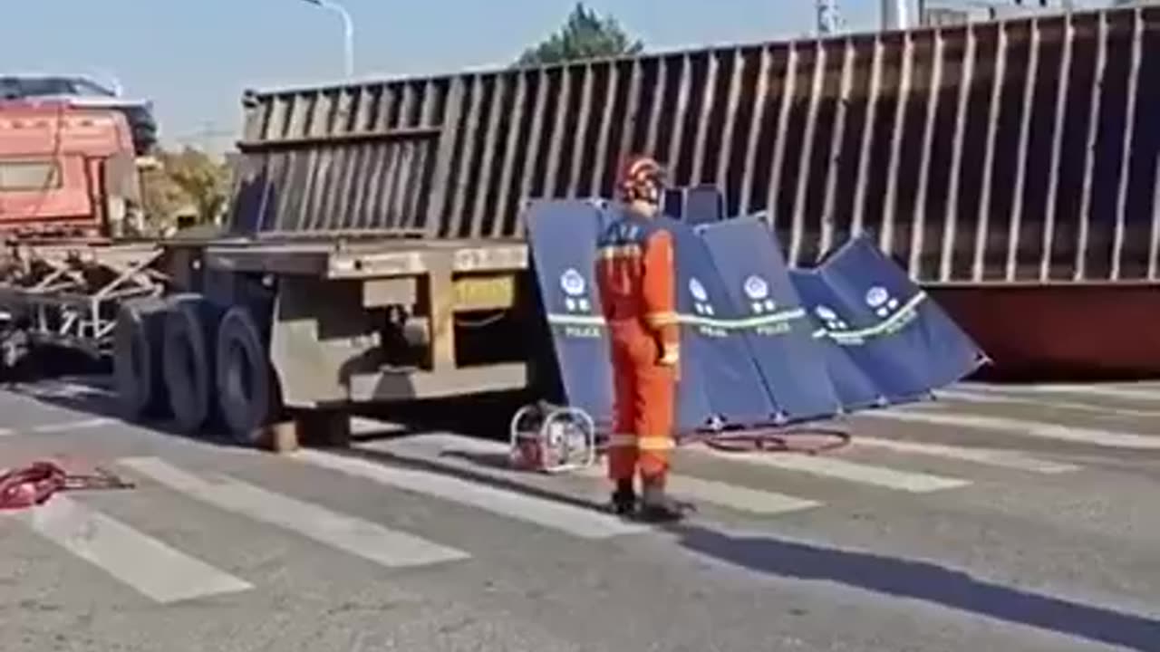 Car Smushed By Truck Cargo