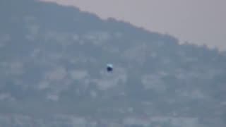 Flying humanoid morphs into a metallic sphere in Turkey.