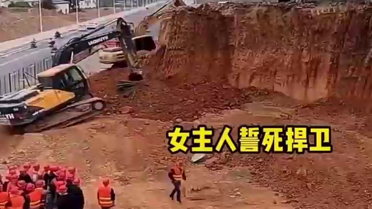 🇨🇳 Facing house demolition, woman vows to defend it! 🤬