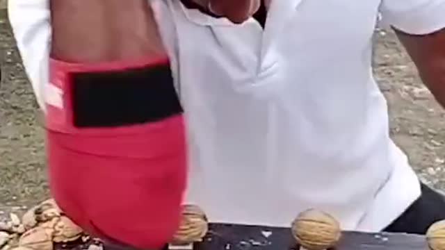 Most walnuts crushed with the elbow in one minute: 279 by Sujith Kumar E