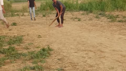 Playing cricket in village