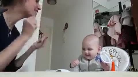 cute baby talking to her mother