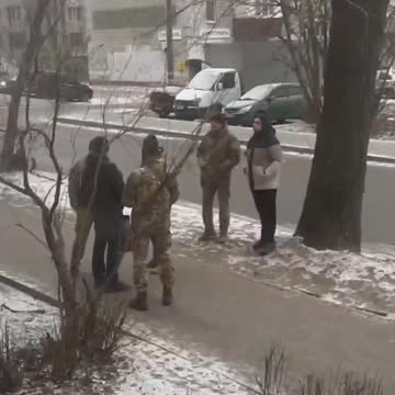 Ukrainian recruitment officers hunt in the streets of Dnipro.