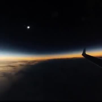 Solar eclipse seen from an airplane in mid-flight