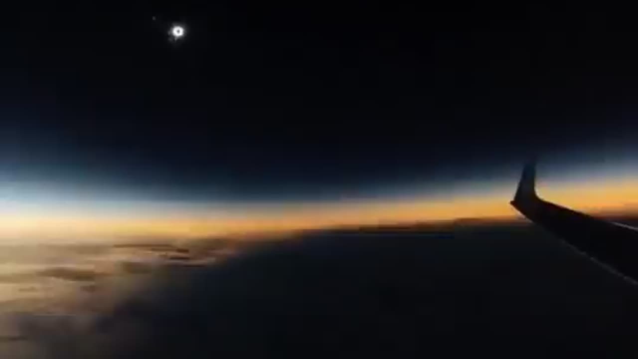 Solar eclipse seen from an airplane in mid-flight