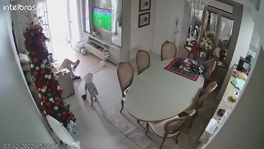 Grandfather Tries to Save Kid From Falling Christmas Tree