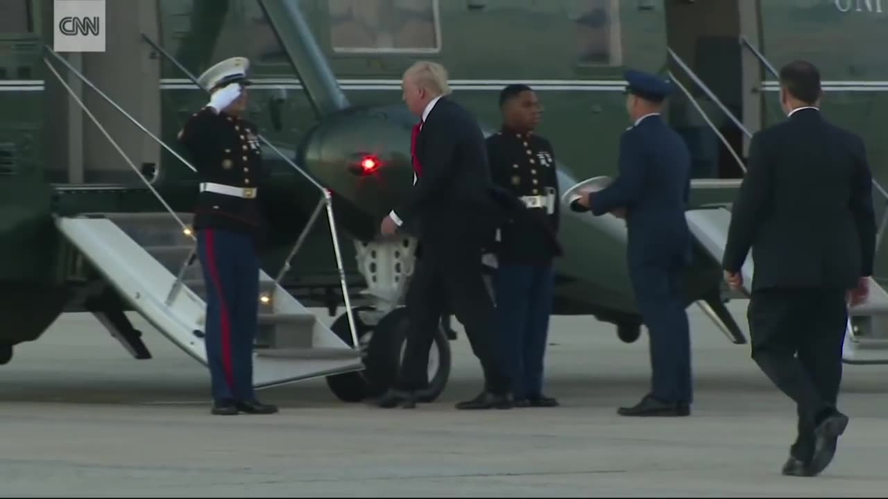 Trump stops to retrieve Marine's hat