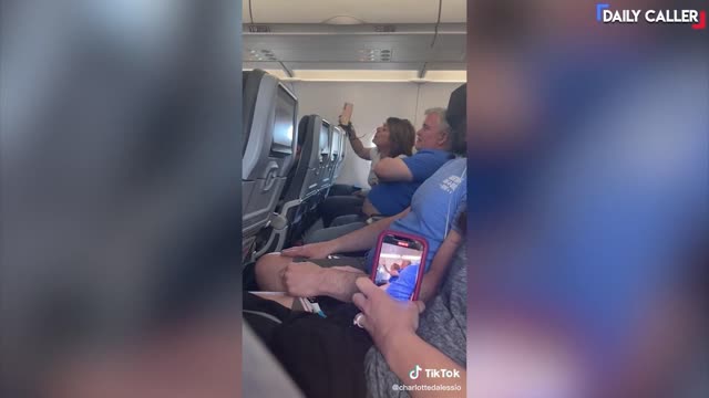 UNHINGED Couple Shouts Obscenities Then Gets Removed From Flight