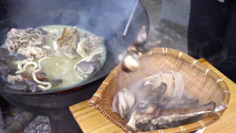 Cooking a Whole Goat Roasted over Fire and Stew for the entire Family