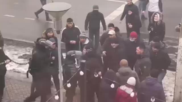 Policeman losing his weapon to protestors Kazakhstan