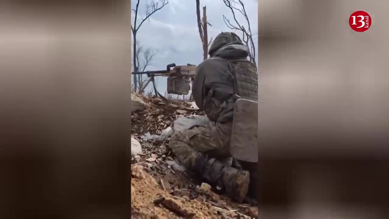 2 Ukrainian fighters fire machine guns and grenades at the approaching Russian attack group