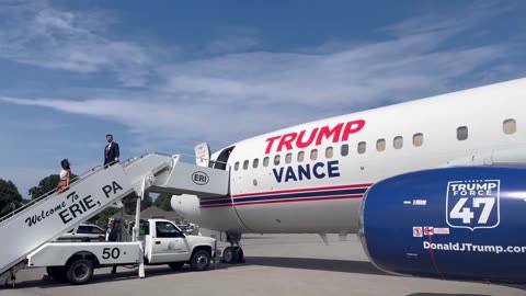 JD and Usha Vance wave to greeters on the tarmac in Erie, PA