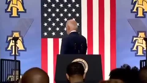 Joe Biden shaking hands with no one there & can't get off the stage, again.