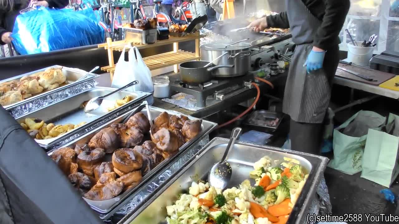 British Sunday Roast of Beef Cooked and Tasted in London. Street Food of Brick Lane