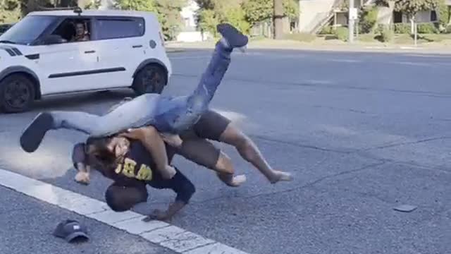 WHITE MAN FIGHTS WITH BLACK MAN AND NEARLY BREAKS HIS NECK