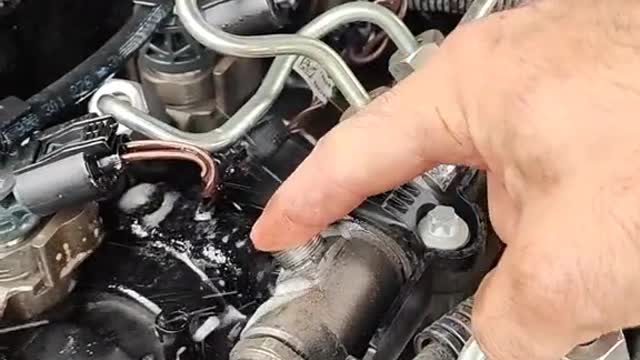 Repairing a car's engine with faulty gadgets.