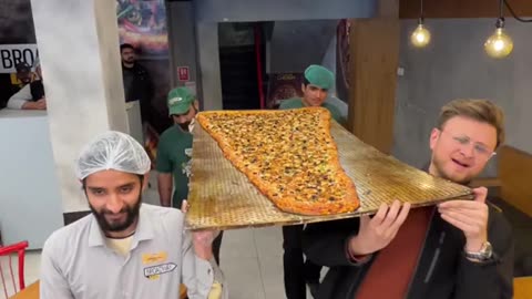 Huge cheesy pizza