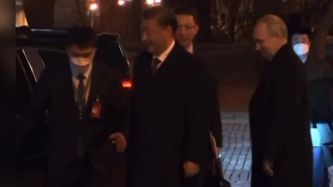 Vladimir Putin escorts Xi Jinping to the car as the first day of his three-day visit