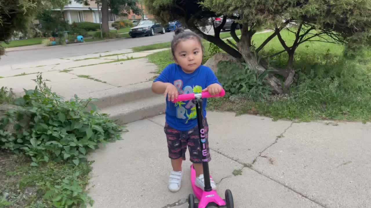 Kids enjoying his new scooter