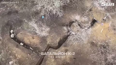Aerial footage shows Ukrainian soldiers fighting Russians in trenches
