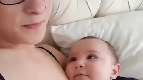 This baby cant keep eyes off his mother