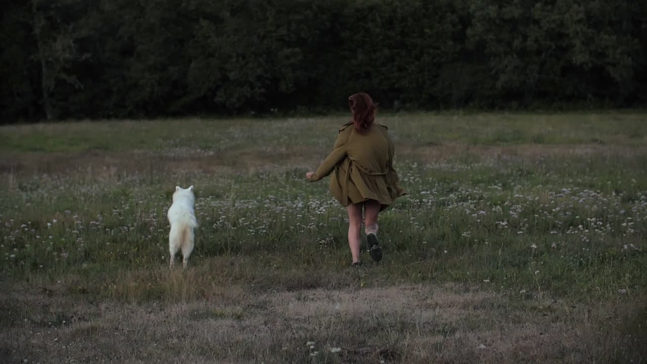 A Girl Playing with her cute dog