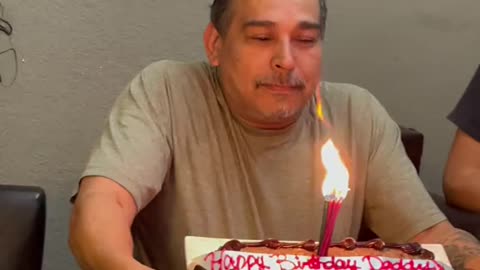 Dad Blowing Out Birthday Candles Loses Teeth