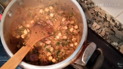 Our breakfast is a Moroccan woman cooking Algerian freekeh soup and Tunisian brik